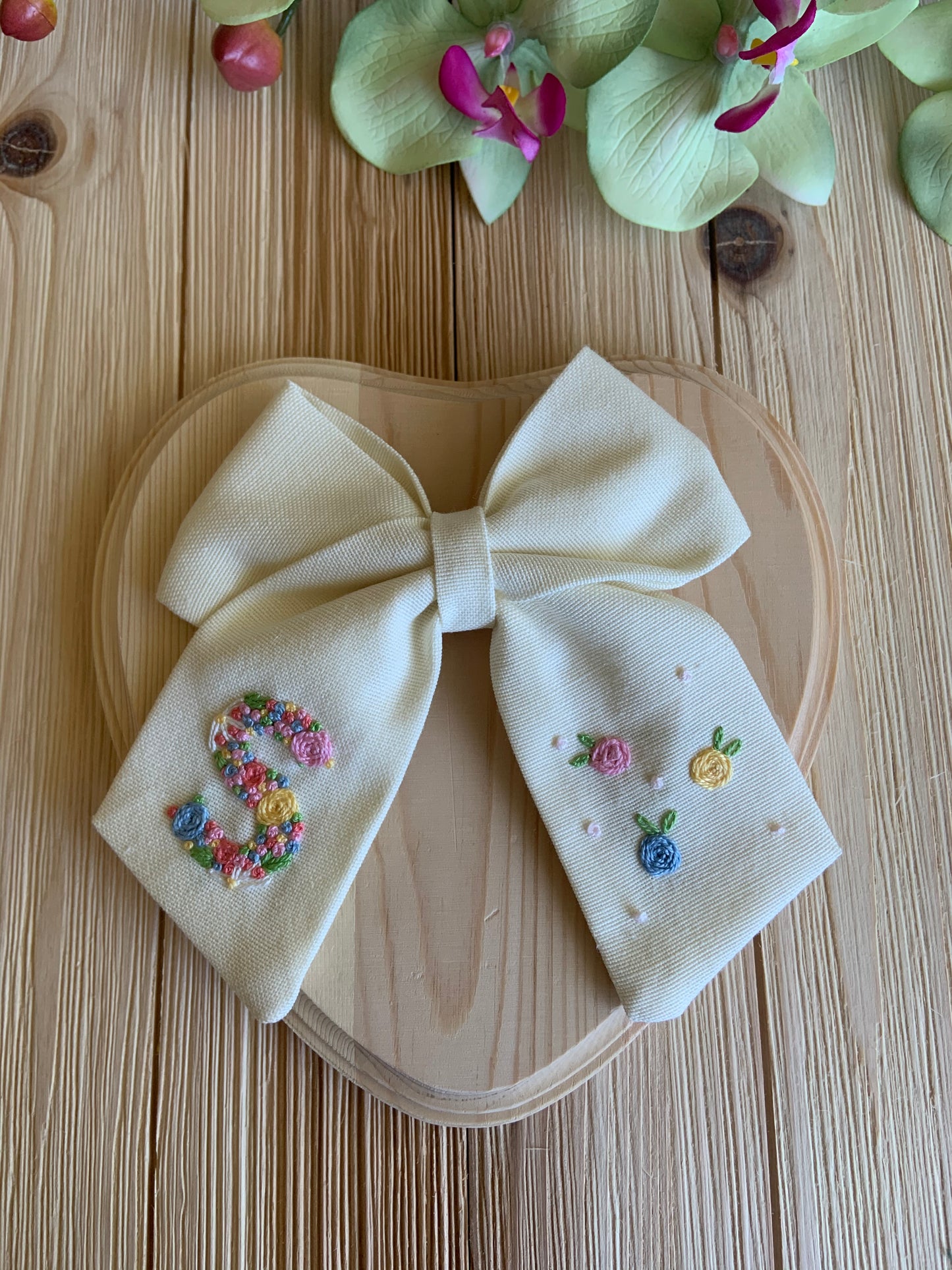 Hand embroidered custom initial Bow